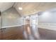 Bright living room with hardwood floors and views into adjacent rooms at 9635 Haverhill Ln, Johns Creek, GA 30022