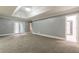 Main bedroom with gray walls, carpeting and access to bathroom at 9635 Haverhill Ln, Johns Creek, GA 30022