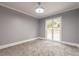 Bright office with a large window and neutral walls at 9635 Haverhill Ln, Johns Creek, GA 30022