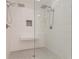 Large walk-in shower with double shower heads and built-in seat at 9635 Haverhill Ln, Johns Creek, GA 30022