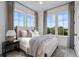 Cozy bedroom with large windows and comfortable bed at 960 Bibbs Nw Cir # 2, Atlanta, GA 30318