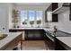 Modern kitchen with dark cabinetry, white subway tile, and stainless steel appliances at 960 Bibbs Nw Cir # 2, Atlanta, GA 30318