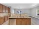 Kitchen island with granite countertop and double sink at 5585 Dendy Trce, Fairburn, GA 30213