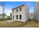 View of the back of the house, showcasing the backyard and a small patio area at 711 Smokey Quartz Way, Kennesaw, GA 30144