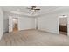 Large carpeted bedroom with ensuite and hallway entrance at 711 Smokey Quartz Way, Kennesaw, GA 30144