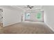 Spacious bedroom with neutral carpet and two windows at 711 Smokey Quartz Way, Kennesaw, GA 30144