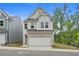 Charming two-story home featuring a brick and siding exterior and a two-car garage at 711 Smokey Quartz Way, Kennesaw, GA 30144