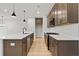 Modern kitchen with a large island, stainless steel appliances, and ample counter space at 711 Smokey Quartz Way, Kennesaw, GA 30144