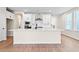 Modern kitchen with white cabinets and a large island at 711 Smokey Quartz Way, Kennesaw, GA 30144