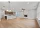 Spacious open floor plan featuring a kitchen and a living room with a fireplace, perfect for modern living at 711 Smokey Quartz Way, Kennesaw, GA 30144