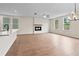 Spacious living area with hardwood floors, fireplace, and a chandelier at 711 Smokey Quartz Way, Kennesaw, GA 30144