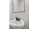 Elegant half-bathroom with a modern sink and a framed mirror, offering a stylish and functional space at 711 Smokey Quartz Way, Kennesaw, GA 30144