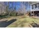 Spacious backyard with deck, screened porch, and lush landscaping at 982 Trestle Dr, Austell, GA 30106