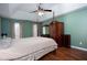 Spacious bedroom with hardwood floors and a large post bed at 982 Trestle Dr, Austell, GA 30106