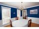 Elegant dining room with hardwood floors and a chandelier at 982 Trestle Dr, Austell, GA 30106