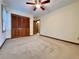 Spacious bedroom with large closet and ceiling fan at 215 Heirloom Ct, Alpharetta, GA 30022