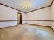 Formal dining room with hardwood floors and chandelier at 215 Heirloom Ct, Alpharetta, GA 30022