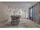 Dining room features a rustic table and chairs with carpet flooring at 4225 Parkridge Dr, Powder Springs, GA 30127