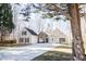 Front view of charming two-story house with stone accents and driveway at 7425 Ivy Grove St, Cumming, GA 30040