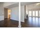 Open floor plan with hardwood floors and a fireplace at 7425 Ivy Grove St, Cumming, GA 30040