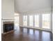 Living room with hardwood floors, fireplace and large windows at 7425 Ivy Grove St, Cumming, GA 30040