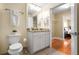 Bathroom with granite countertop and white cabinets at 230 E Ponce De Leon Ave # 317, Decatur, GA 30030