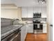 Modern kitchen with granite countertops and stainless steel appliances at 230 E Ponce De Leon Ave # 317, Decatur, GA 30030
