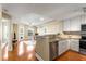 Open kitchen with granite countertops and stainless steel appliances at 230 E Ponce De Leon Ave # 317, Decatur, GA 30030