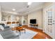 Open living room with hardwood floors and access to kitchen and balcony at 230 E Ponce De Leon Ave # 317, Decatur, GA 30030