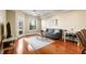 Bright living room with hardwood floors, gray sofa, and balcony access at 230 E Ponce De Leon Ave # 317, Decatur, GA 30030