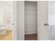 Bathroom featuring a water closet, shelving, and neutral carpeting at 7289 Eton Ln, Locust Grove, GA 30248