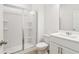 Bathroom with white cabinets and a glass door shower at 7289 Eton Ln, Locust Grove, GA 30248