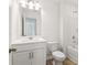 A standard bathroom features double lights, a mirror, and a vanity with cabinets at 7289 Eton Ln, Locust Grove, GA 30248