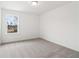 The home features a standard sized bedroom with neutral carpeting and a window at 7289 Eton Ln, Locust Grove, GA 30248
