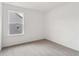 Bedroom with neutral carpet, one window, and white walls at 7289 Eton Ln, Locust Grove, GA 30248