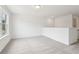 Open bonus room with neutral carpet and ample natural light at 7289 Eton Ln, Locust Grove, GA 30248