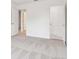 The hallway features neutral carpeting and a standard closet at 7289 Eton Ln, Locust Grove, GA 30248