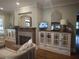 Living room with built-in shelving, fireplace and hardwood floors at 3463 Lee St, Smyrna, GA 30080