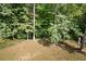 Wooded backyard with a grassy area at 3454 Hill Ln, Acworth, GA 30102