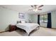 Main bedroom with ceiling fan, window and dark curtains at 3454 Hill Ln, Acworth, GA 30102