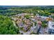 Aerial view showing a neighborhood with houses and lush green surroundings at 360 Chambers St # 310, Woodstock, GA 30188