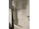 Spotless shower-tub combination with bright shower curtain and built-in shelves at 20 Marietta Nw St # 6F, Atlanta, GA 30303