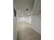 Long hallway showcasing tile flooring and neutral walls, creating a clean and modern aesthetic at 20 Marietta Nw St # 6F, Atlanta, GA 30303