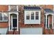 Brick townhouse with a 2-car garage and black door at 2782 Loftview Sq # 1, Atlanta, GA 30339