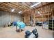 Unfinished basement with exposed beams and insulation, offering potential for customization and extra space at 9475 Dunmoore Dr, Cumming, GA 30028