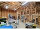 Partially finished basement area, framed with exposed beams, with potential for custom remodeling and lots of storage at 9475 Dunmoore Dr, Cumming, GA 30028