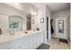 Bathroom with double sinks, a soaking tub and a glass enclosed shower at 9475 Dunmoore Dr, Cumming, GA 30028