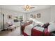 Bedroom with carpeted floors, natural light, and a ceiling fan at 9475 Dunmoore Dr, Cumming, GA 30028