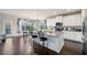 Bright kitchen with granite countertops, stainless steel appliances, and an adjacent dining area at 9475 Dunmoore Dr, Cumming, GA 30028