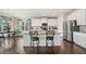 Modern kitchen with stainless steel appliances, granite countertops, and a large kitchen island at 9475 Dunmoore Dr, Cumming, GA 30028
